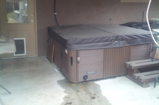 Hot tub showing visible damp patches underneath — a sign to check for a leak and apply Fix A Leak