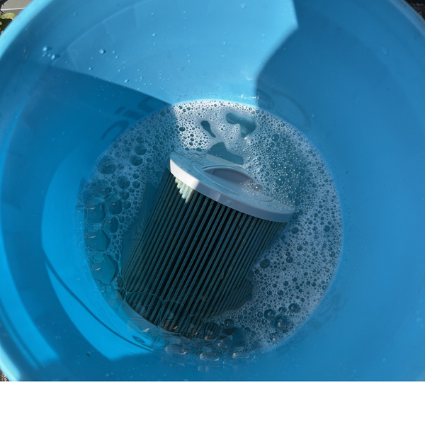 Hot tub filter cartridge soaking in Canadian Spa Filter Cleaner solution for a thorough deep clean